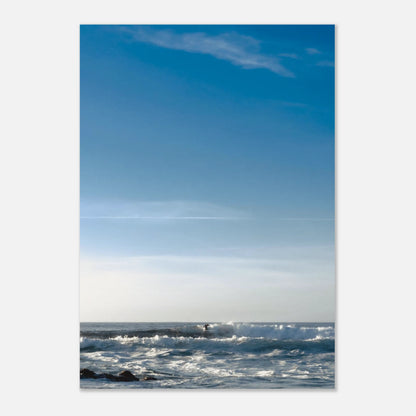This minimalist lake photography print features a serene blue-toned landscape with soft mountain views and subtle human presence, making it ideal for calm wall art, modern coastal decor, and minimalist interior design. Perfect for living rooms and bedrooms, this fine art print blends tranquility with gentle movement through soft blue hues and balanced composition.