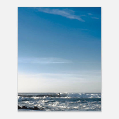 This minimalist lake photography print features a serene blue-toned landscape with soft mountain views and subtle human presence, making it ideal for calm wall art, modern coastal decor, and minimalist interior design. Perfect for living rooms and bedrooms, this fine art print blends tranquility with gentle movement through soft blue hues and balanced composition.